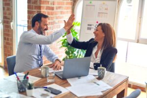 Two people celebrating success with a high five